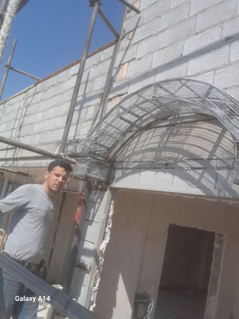 جوشکاری و درب وپنجره سازی وشیروانی ونبش کشی ساختمان 1